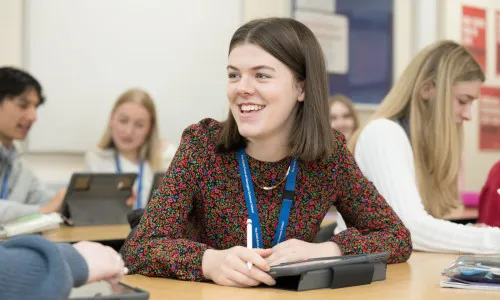 girl in class smiling - Nov 23